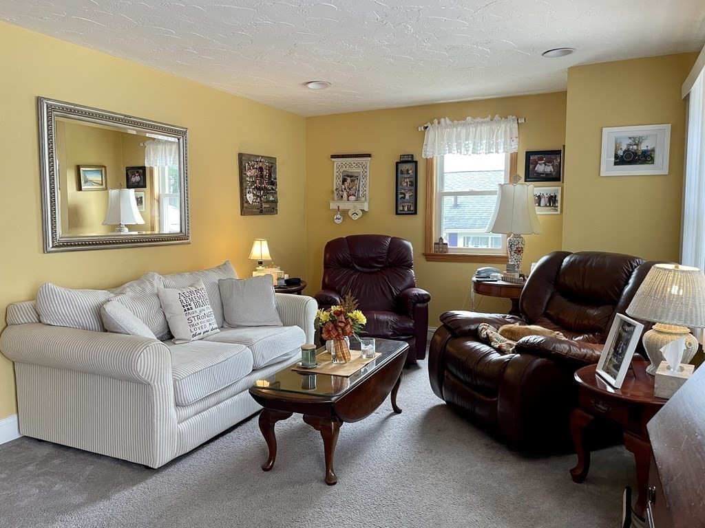 67 Colonial Road Weymouth, MA 02191 - Photo 4 of 31 a living room with furniture and a window