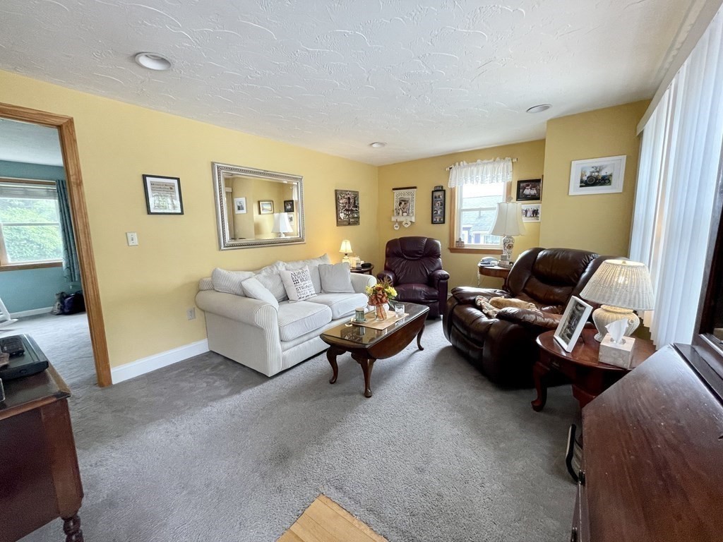 67 Colonial Road Weymouth, MA 02191 - Photo 5 of 31 a living room with furniture and a large window