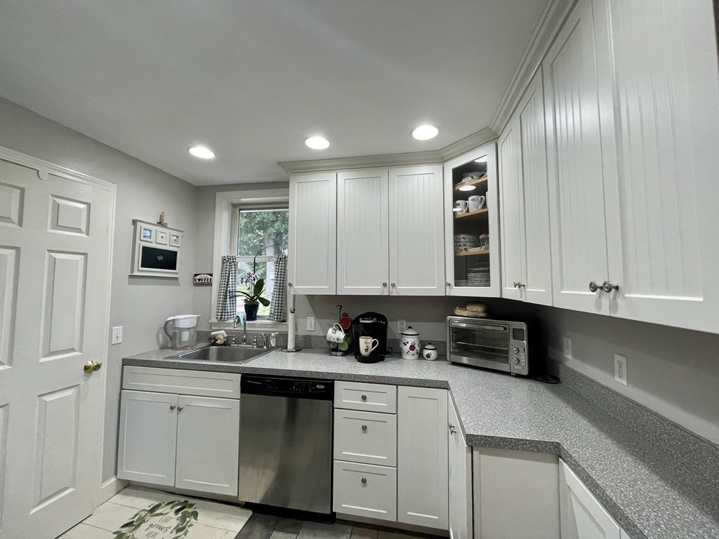 67 Colonial Road Weymouth, MA 02191 - Photo 8 of 31 a kitchen with appliances cabinets and a sink
