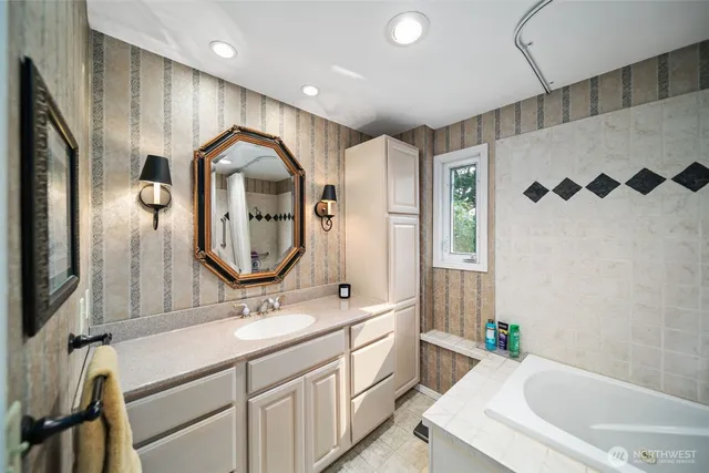 a spacious bedroom with a bed and a window