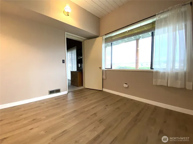 a bathroom with a shower toilet and tub