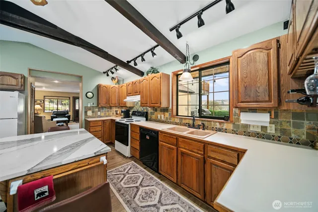 a view of a dining room with furniture window and outside view
