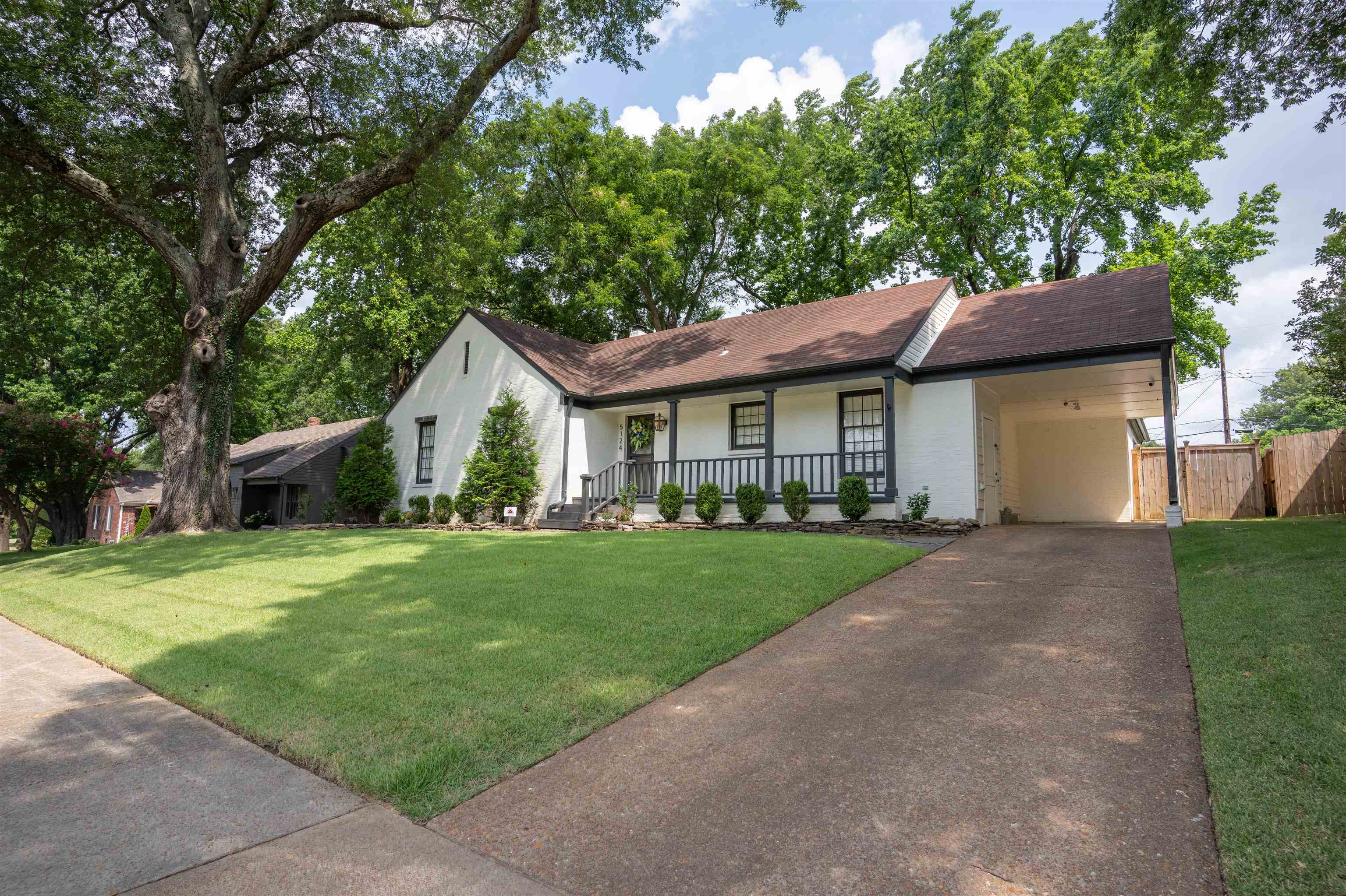 5124 Rich Road Memphis, TN 38117 - Photo 3 of 26 a front view of a house with a garden