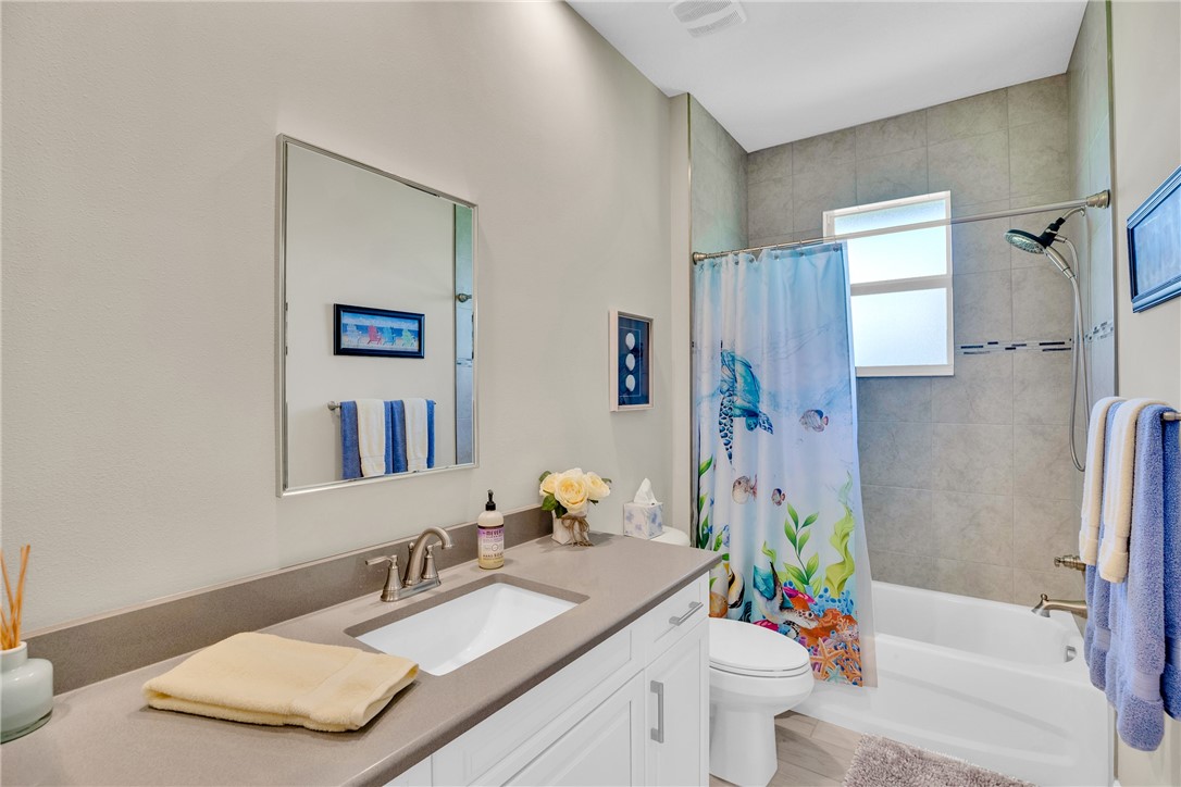 105 Night Hawk Way Sebastian, FL 32958 - Photo 26 of 36 a bathroom with a sink a toilet and shower