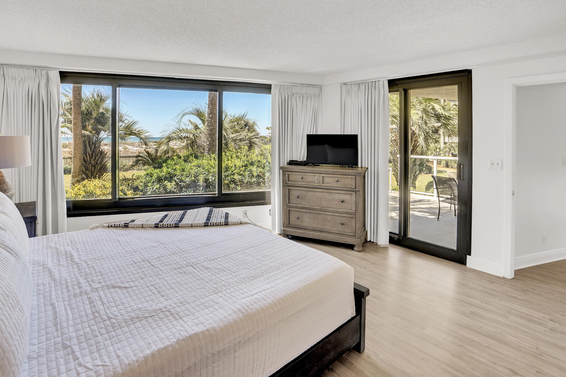 4202 Beachside 2, Unit 202 Miramar Beach, FL 32550 - Photo 12 of 45 a bed room with a bed and a window