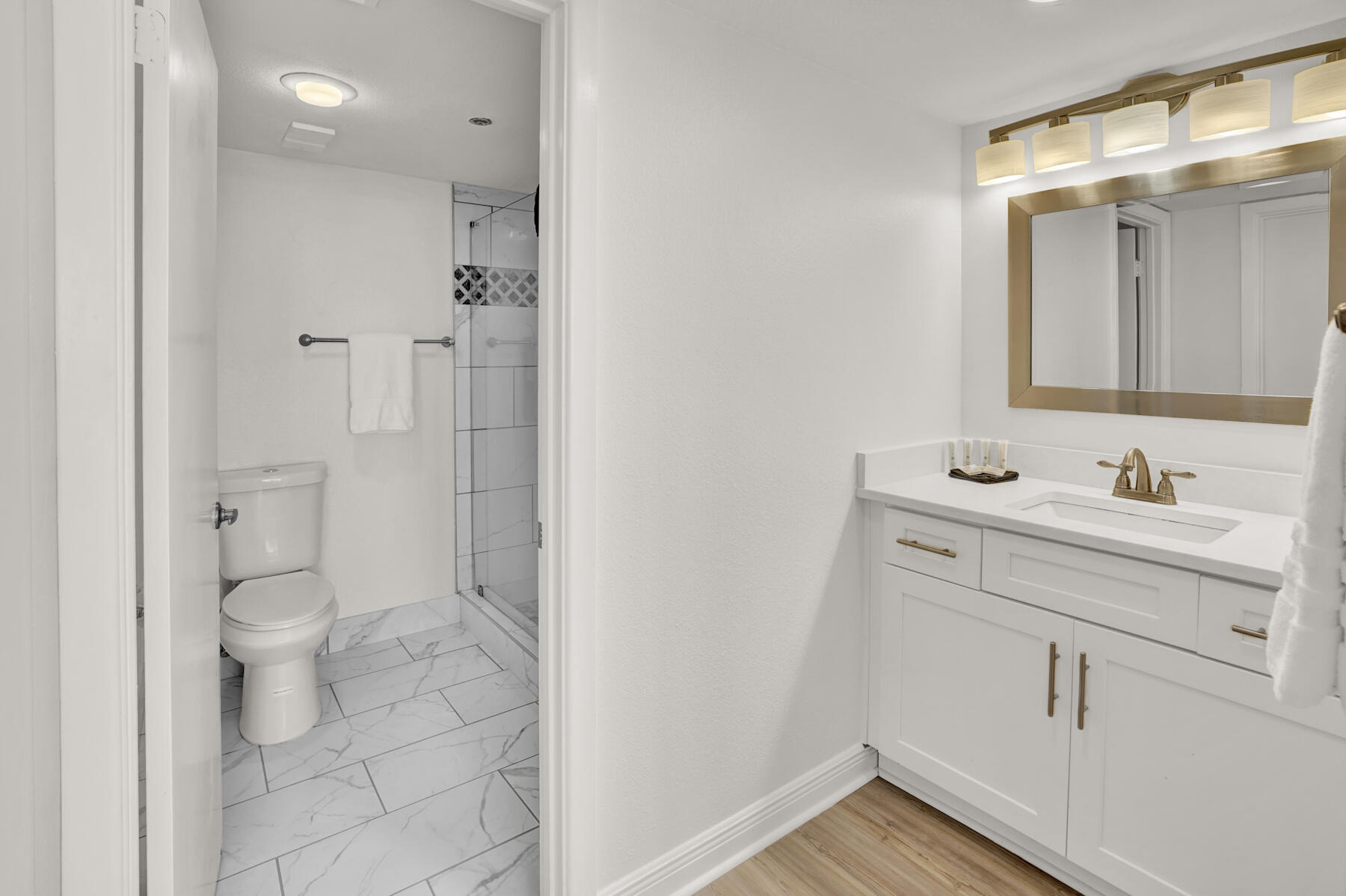 4202 Beachside 2, Unit 202 Miramar Beach, FL 32550 - Photo 14 of 45 a bathroom with a sink a toilet and shower