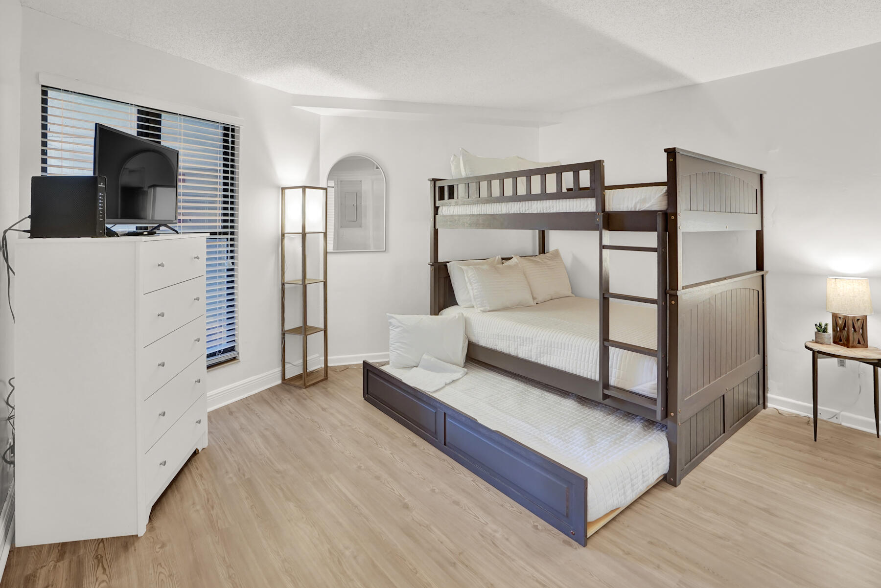 4202 Beachside 2, Unit 202 Miramar Beach, FL 32550 - Photo 17 of 45 a bedroom with a bed and flat screen tv