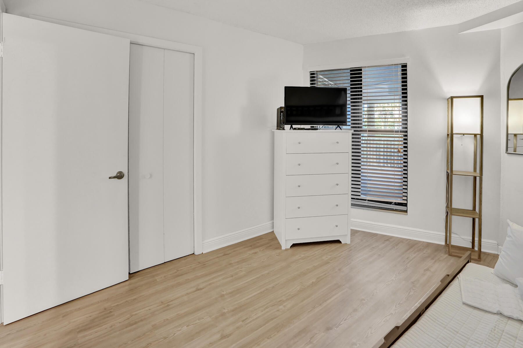 4202 Beachside 2, Unit 202 Miramar Beach, FL 32550 - Photo 19 of 45 an empty room with wooden floor and air conditioner