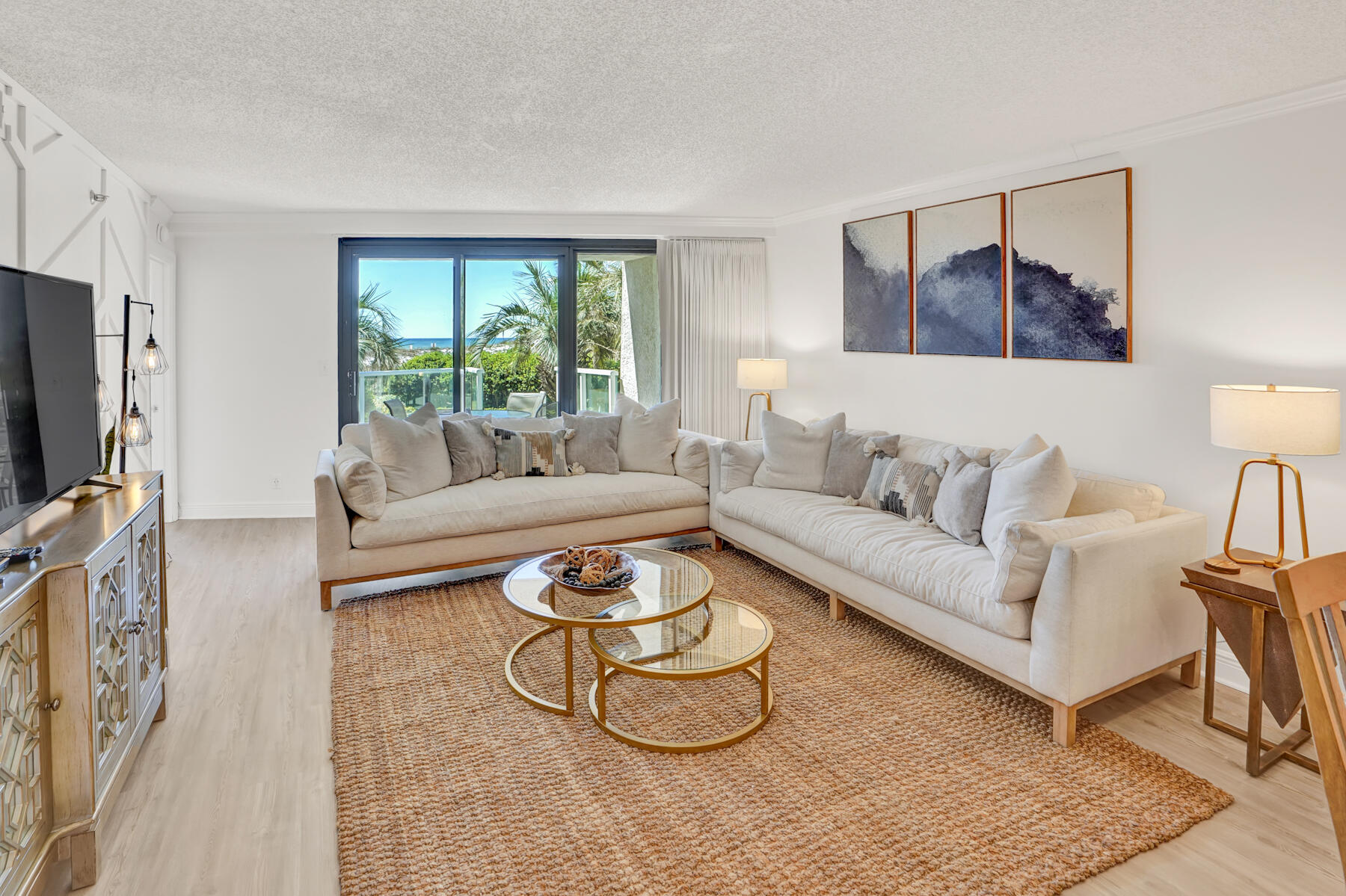 4202 Beachside 2, Unit 202 Miramar Beach, FL 32550 - Photo 2 of 45 a living room with furniture and a flat screen tv