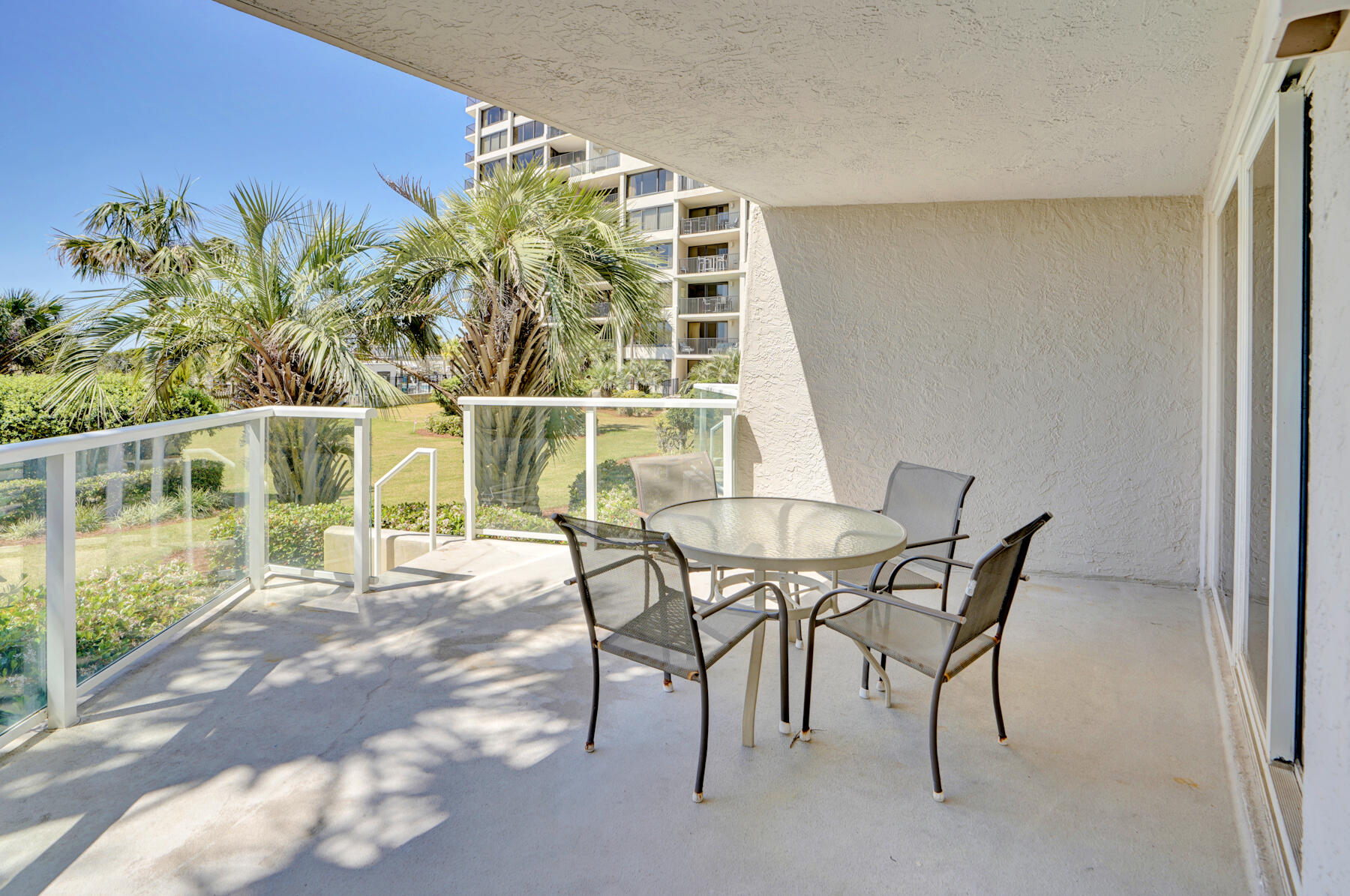 4202 Beachside 2, Unit 202 Miramar Beach, FL 32550 - Photo 22 of 45 a view of a dining room with furniture and a potted plant
