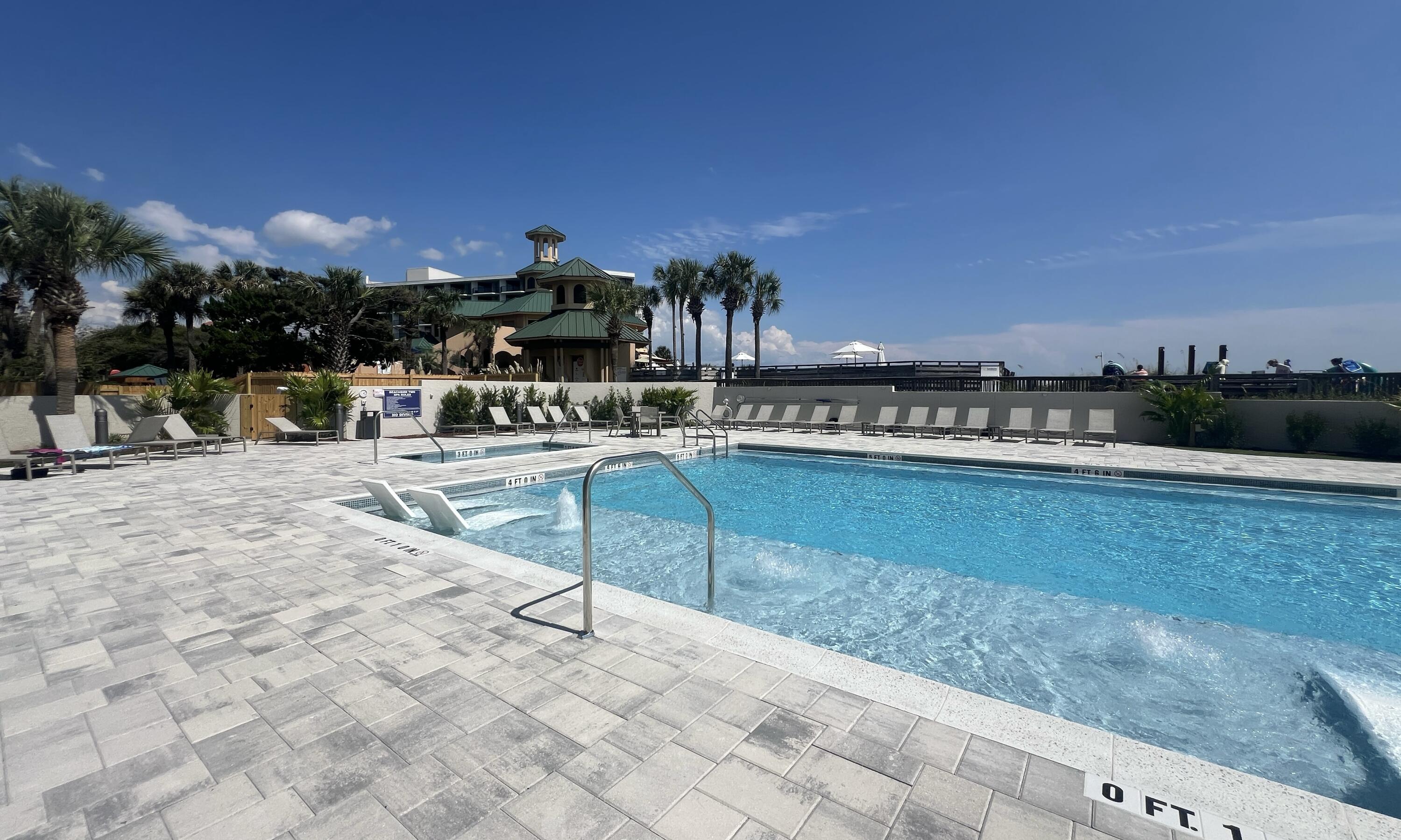 4202 Beachside 2, Unit 202 Miramar Beach, FL 32550 - Photo 26 of 45 a swimming pool with outdoor seating and yard
