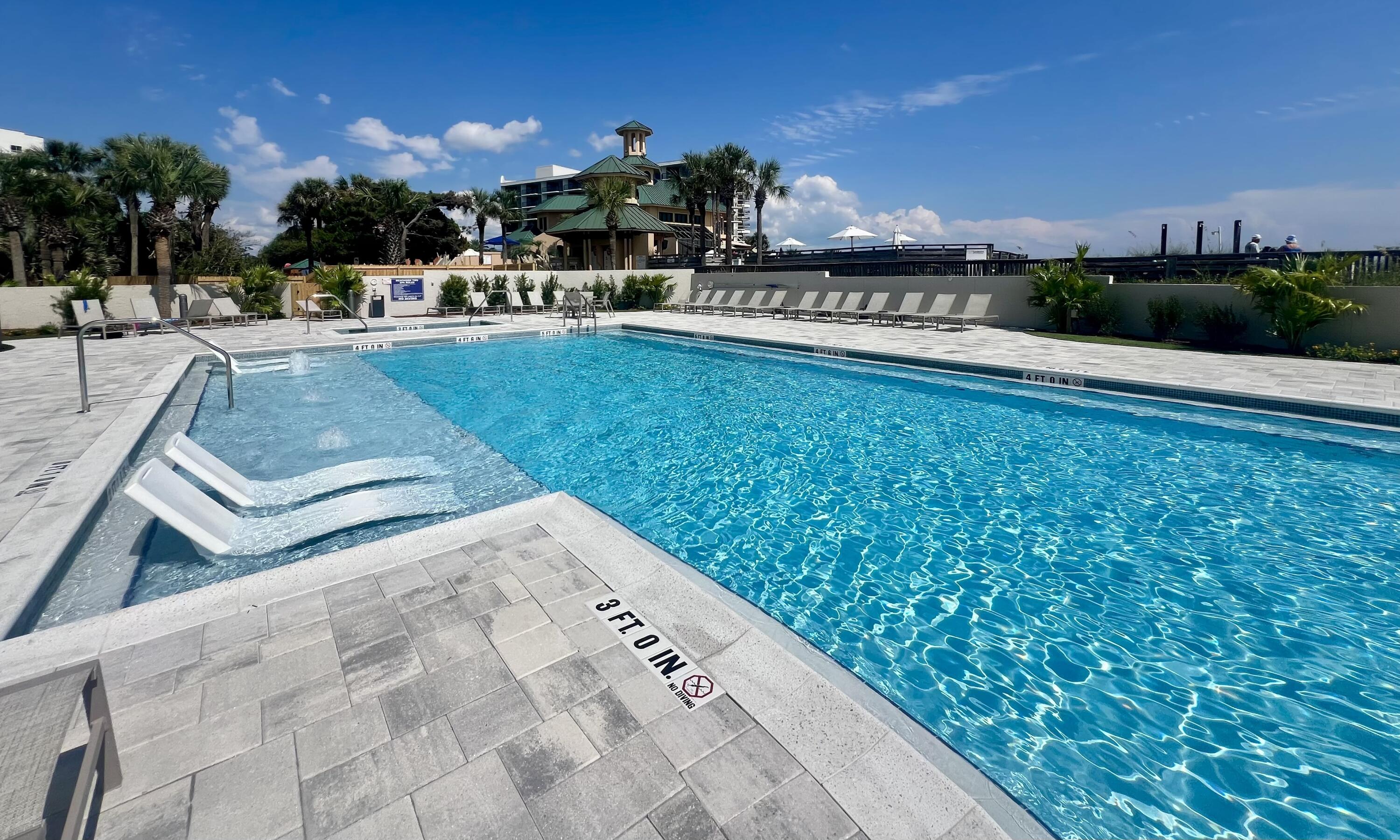 4202 Beachside 2, Unit 202 Miramar Beach, FL 32550 - Photo 28 of 45 a view of a swimming pool with outdoor seating and plants