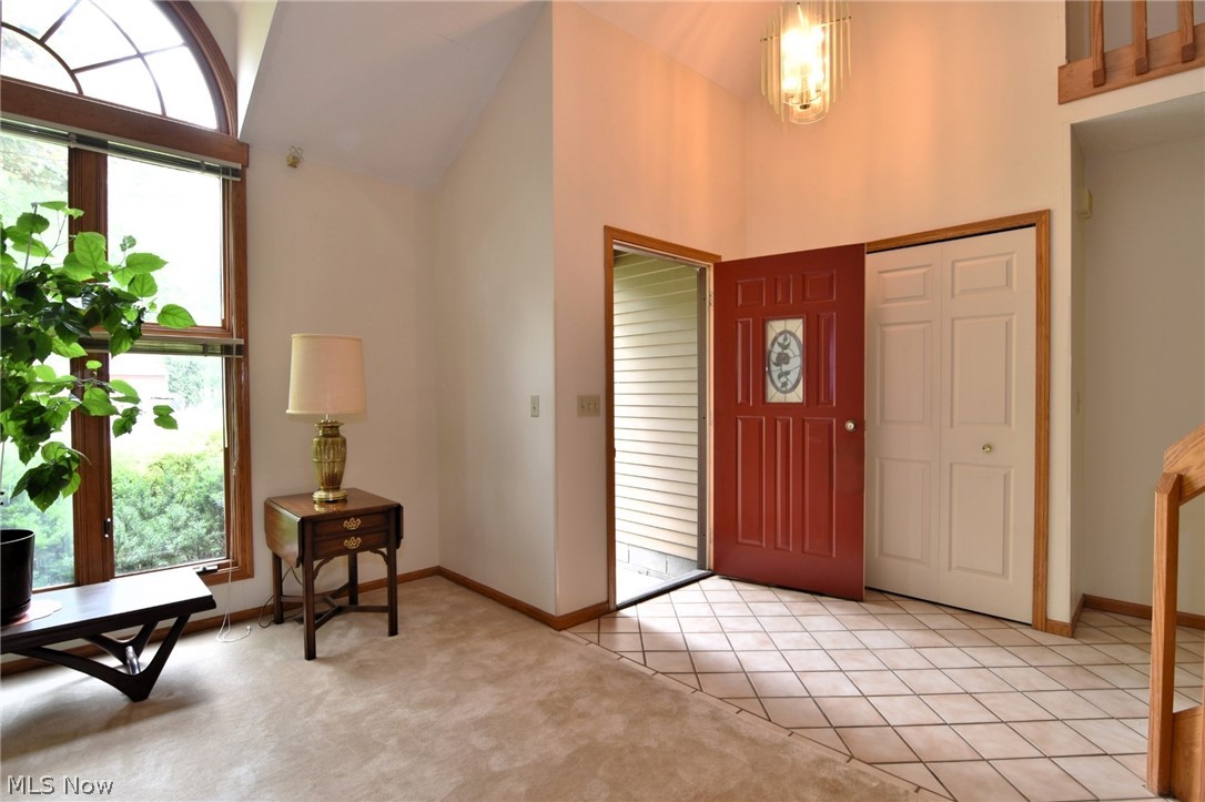 7655 Bellflower Road Mentor, OH 44060 - Photo 2 of 28 Foyer with carpet and high vaulted ceiling