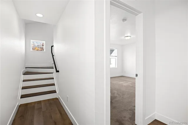 a view of a hallway with a hallway and stairs