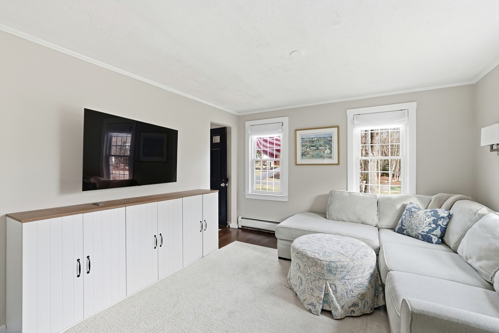 73 Shingle Mill Lane Hanover, MA 02339 - Photo 11 of 23 a living room with furniture and a flat screen tv