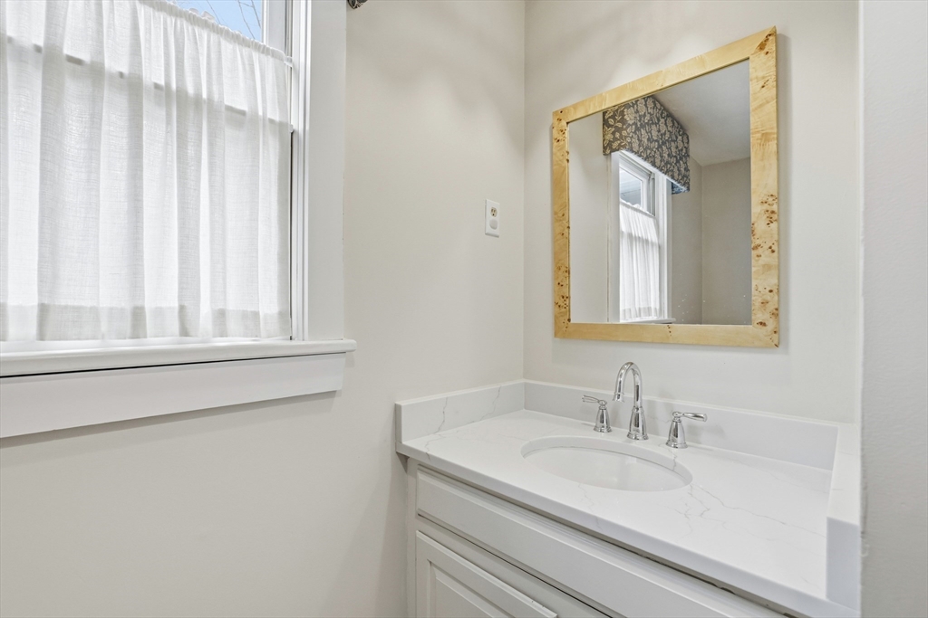 73 Shingle Mill Lane Hanover, MA 02339 - Photo 15 of 23 a bathroom with a granite countertop sink and a mirror