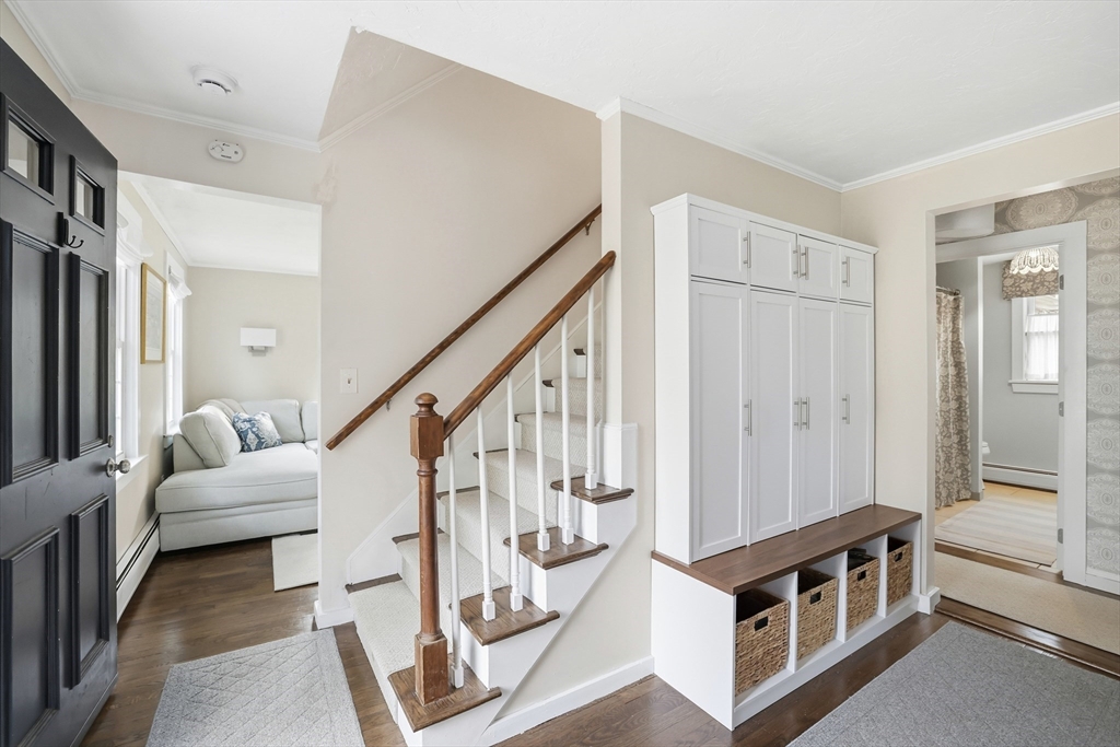 73 Shingle Mill Lane Hanover, MA 02339 - Photo 16 of 23 a view of an entryway with wooden floor and stairs