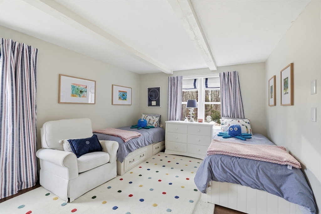 73 Shingle Mill Lane Hanover, MA 02339 - Photo 17 of 23 a bedroom with a large bed couch and a window