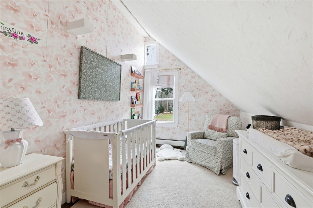 73 Shingle Mill Lane Hanover, MA 02339 - Photo 18 of 23 a living room with furniture and a flat screen tv