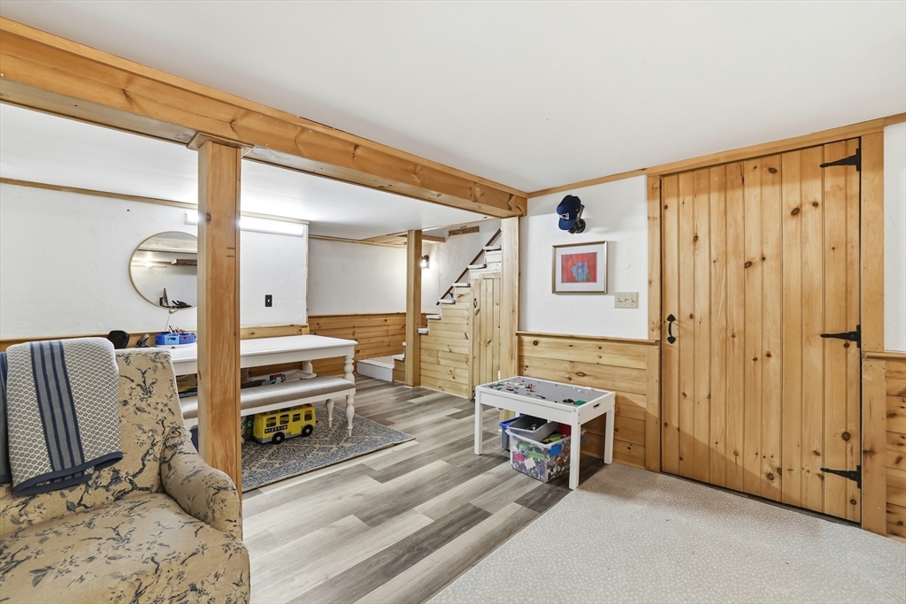 73 Shingle Mill Lane Hanover, MA 02339 - Photo 21 of 23 a living room with furniture a flat screen tv and a window