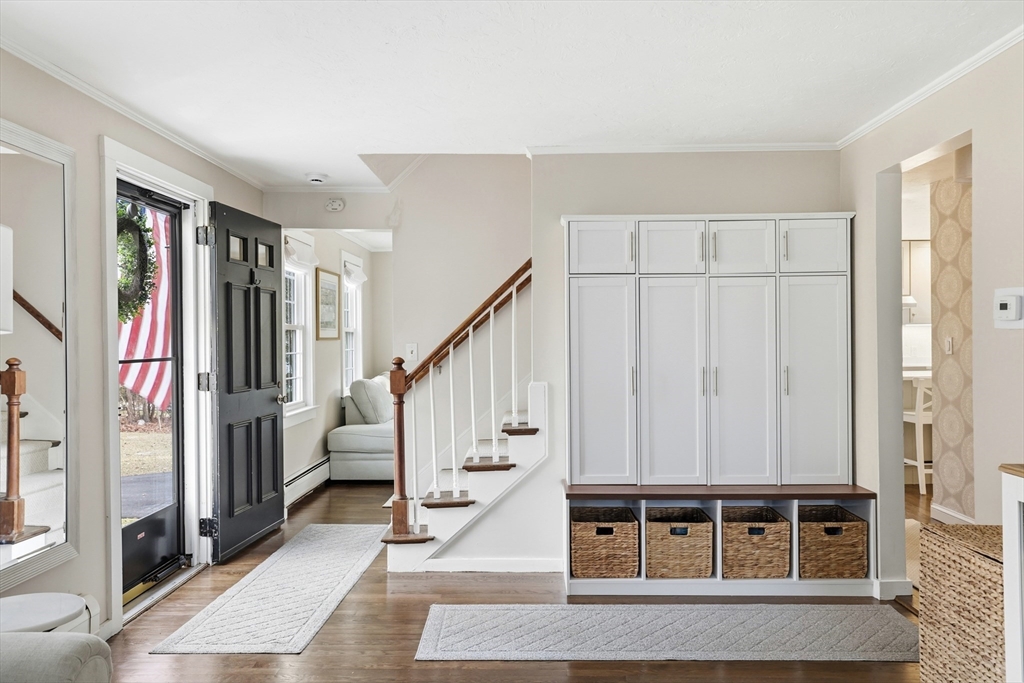 73 Shingle Mill Lane Hanover, MA 02339 - Photo 3 of 23 a view of staircase with lots of frames on wall and a window