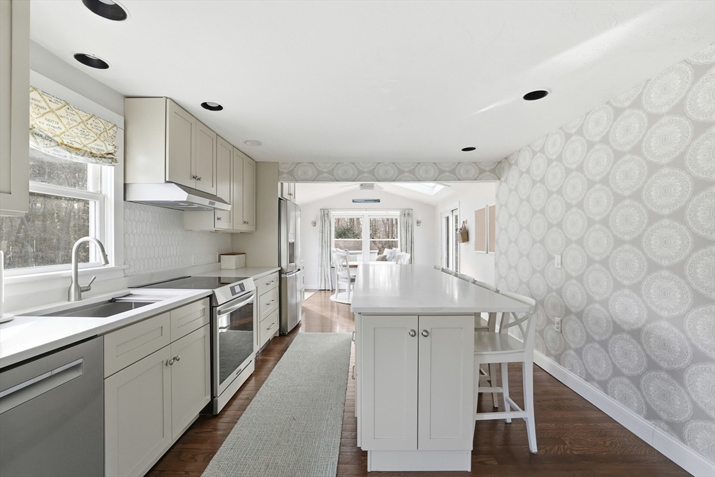 73 Shingle Mill Lane Hanover, MA 02339 - Photo 6 of 23 a kitchen with stainless steel appliances a sink and cabinets