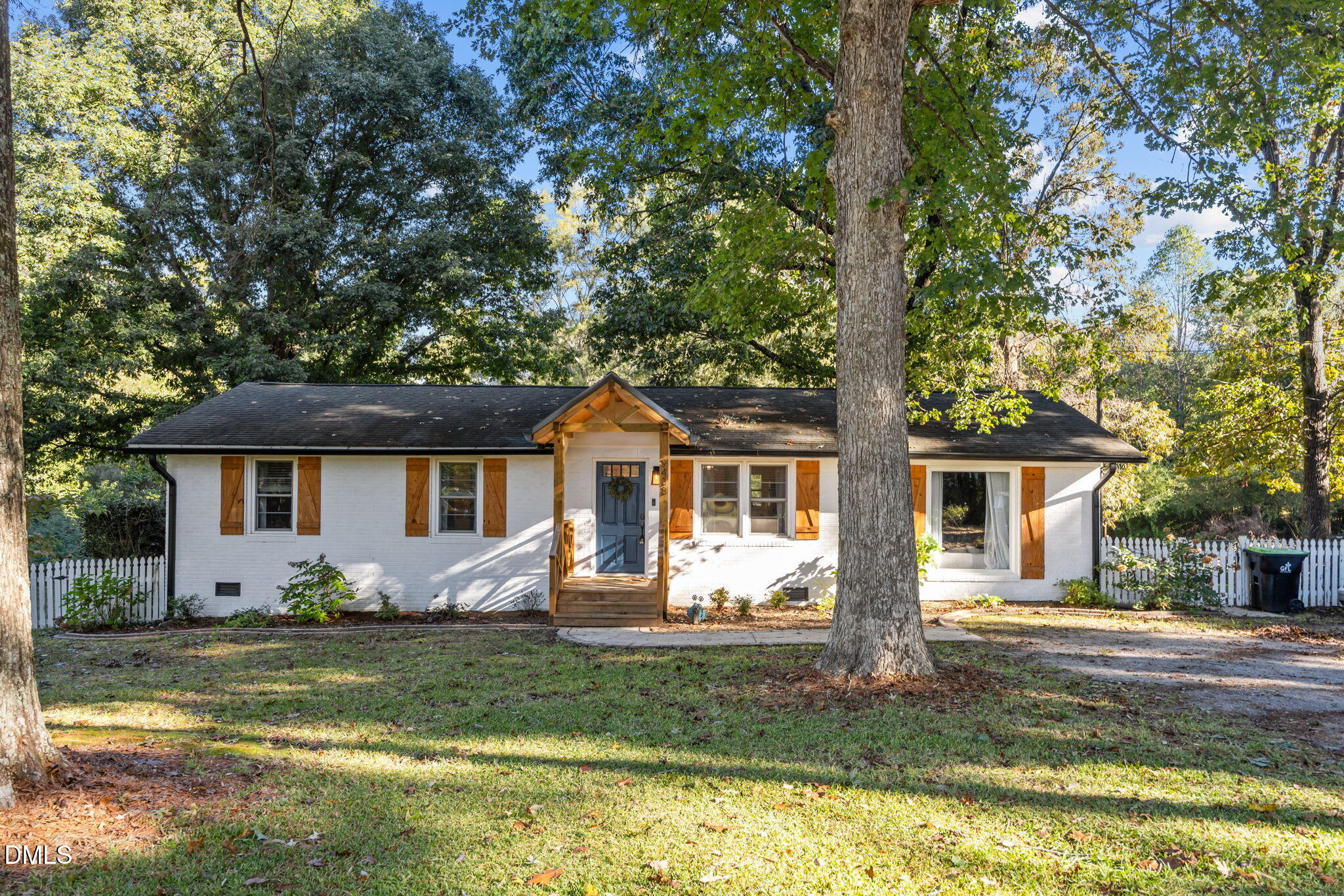 9433 Ferrell Road Zebulon, NC 27597 - Photo 1 of 38 a front view of house with yard and green space