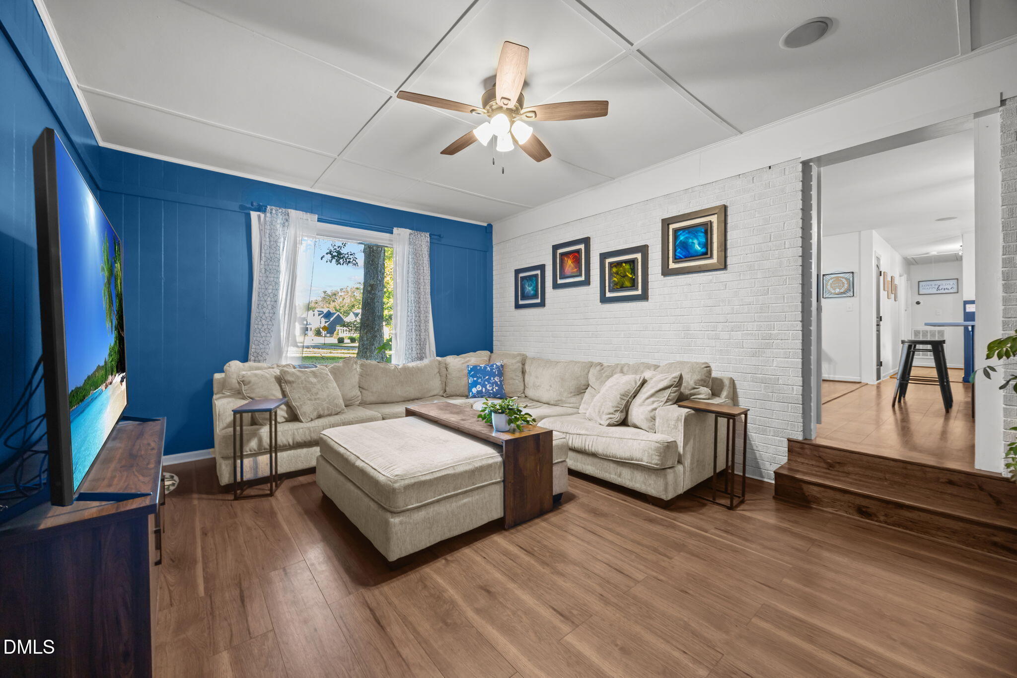 9433 Ferrell Road Zebulon, NC 27597 - Photo 12 of 38 a living room with furniture and a large window