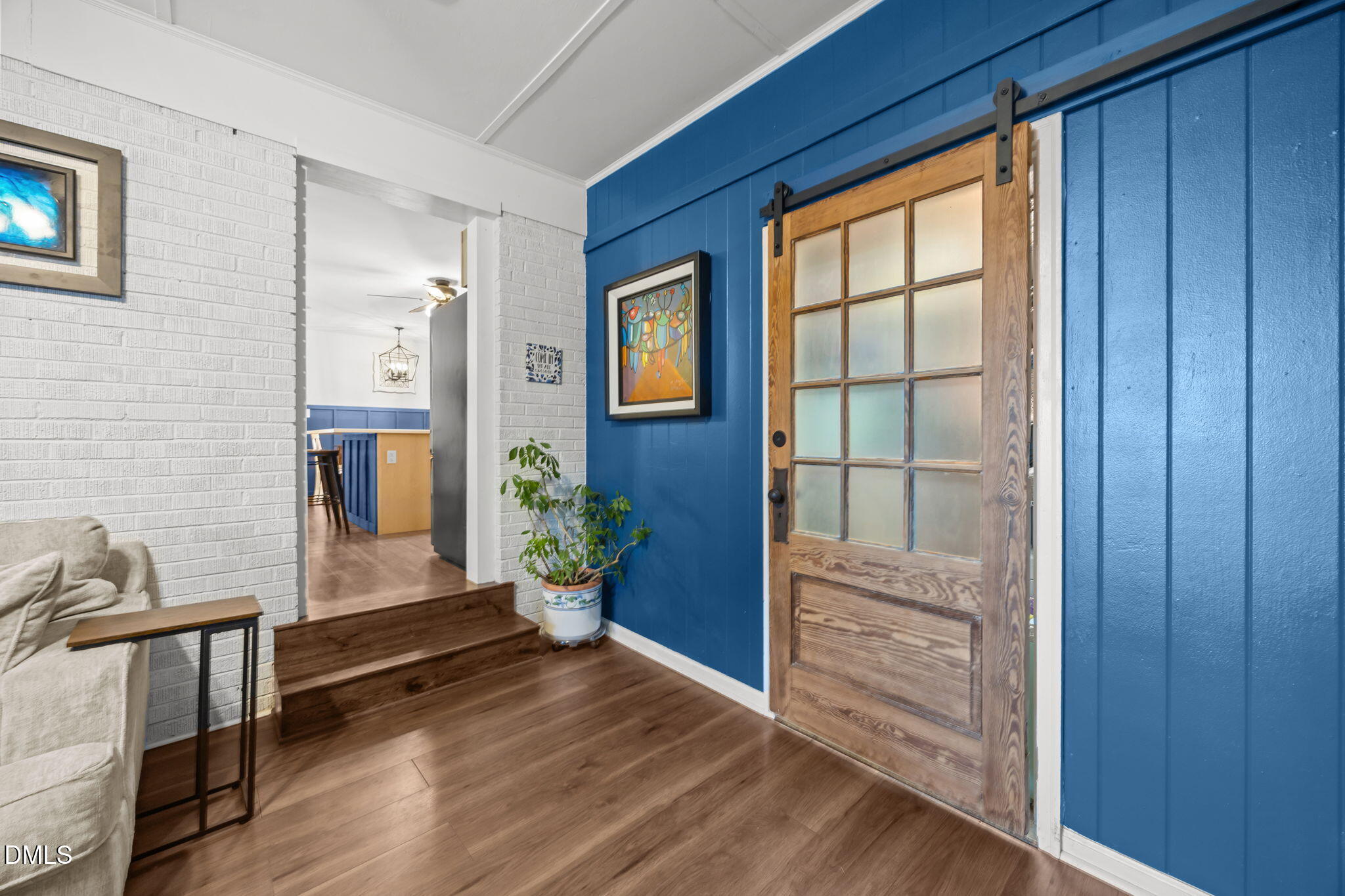 9433 Ferrell Road Zebulon, NC 27597 - Photo 13 of 38 a room with wooden floor and a window