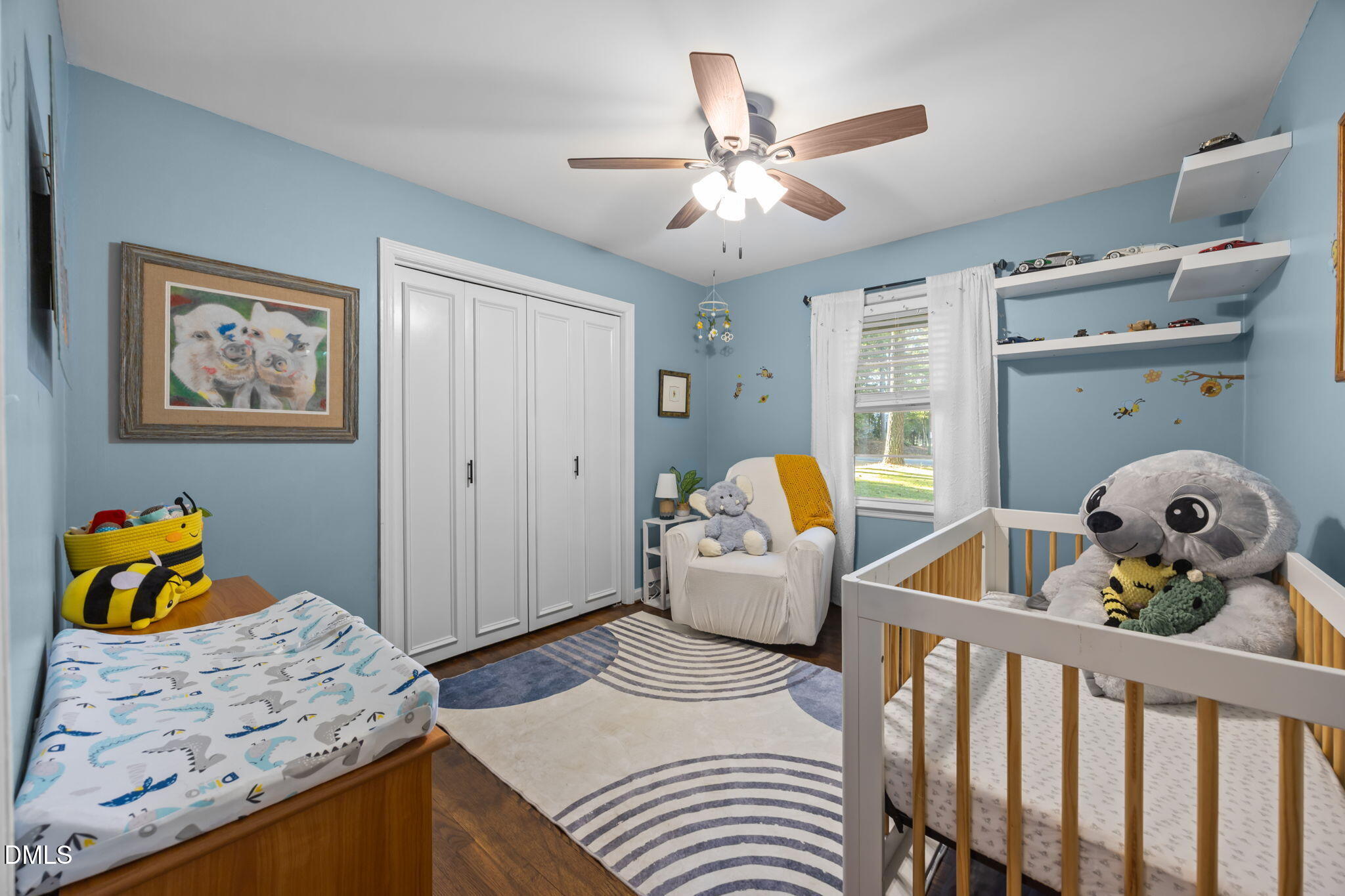 9433 Ferrell Road Zebulon, NC 27597 - Photo 14 of 38 a bedroom with furniture and wooden floor