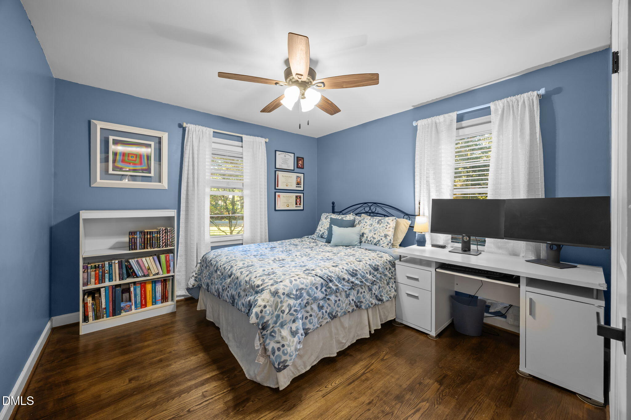 9433 Ferrell Road Zebulon, NC 27597 - Photo 15 of 38 a bedroom with a bed and a book shelf