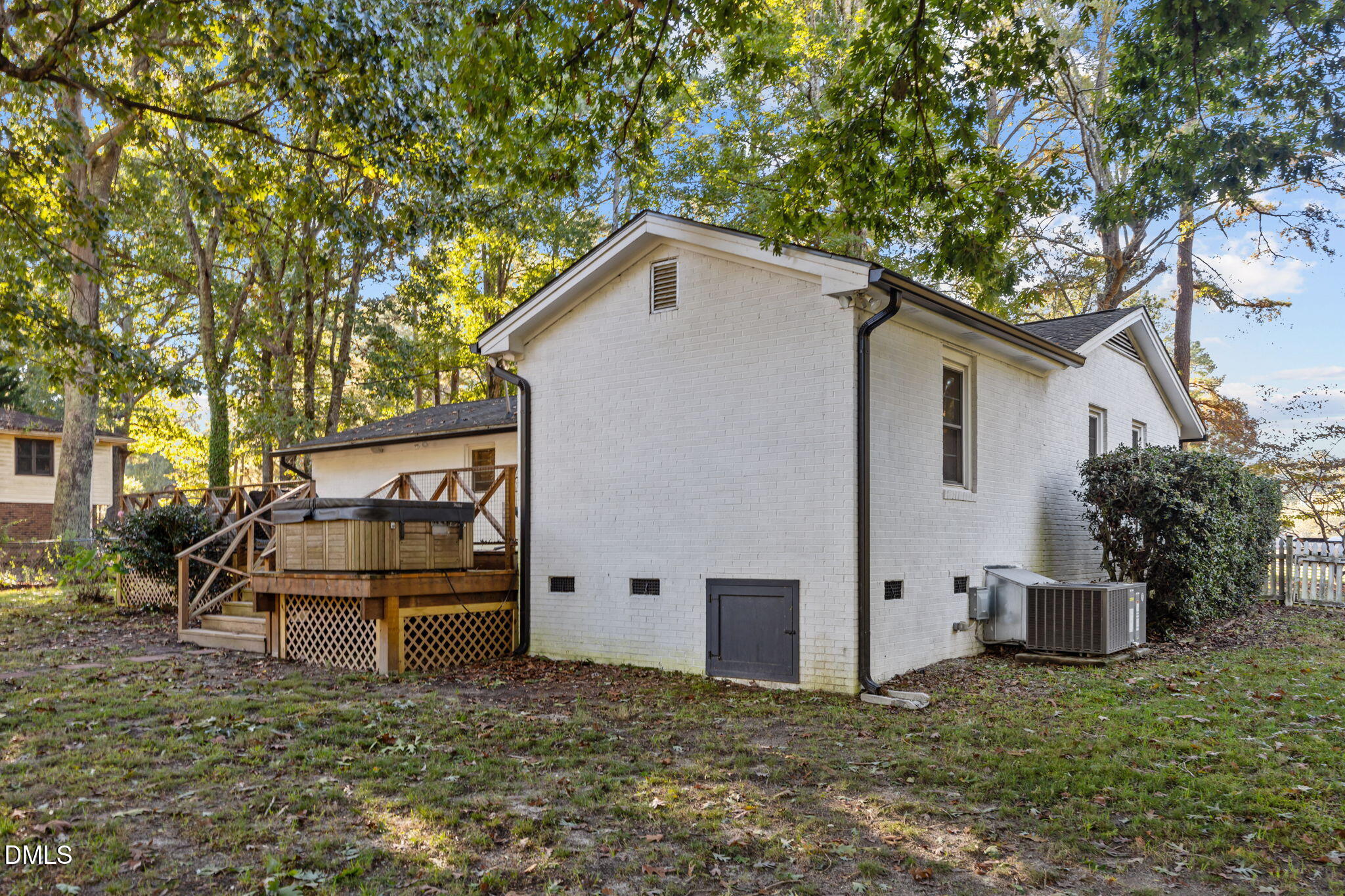 9433 Ferrell Road Zebulon, NC 27597 - Photo 24 of 38 a white house that has tree in front of it