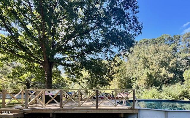9433 Ferrell Road Zebulon, NC 27597 - Photo 27 of 38 a view of small yard with wooden fence