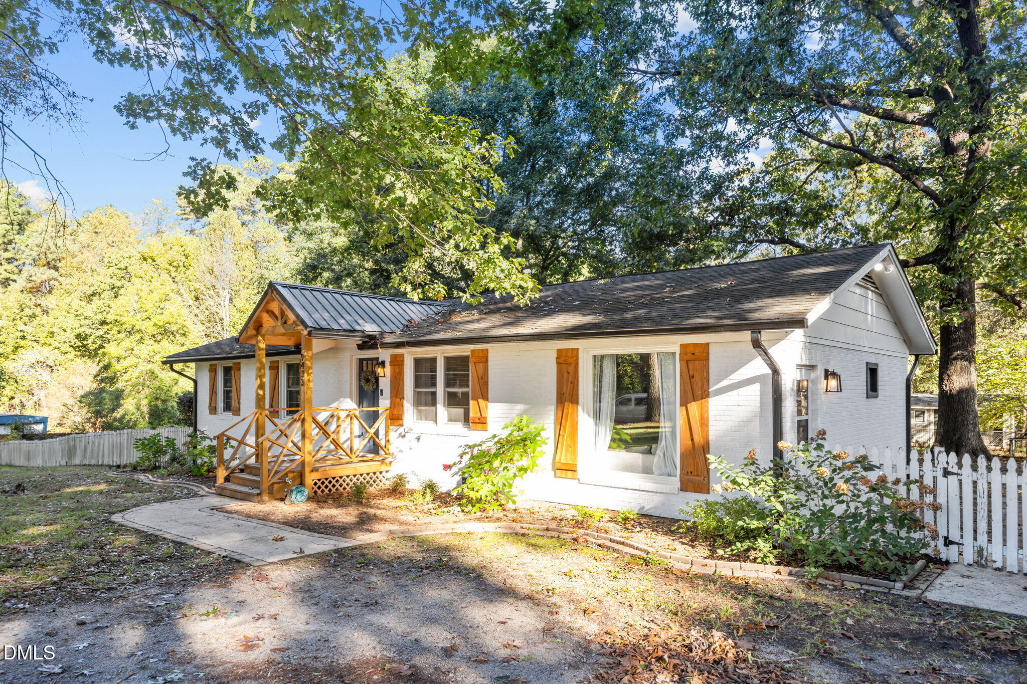 9433 Ferrell Road Zebulon, NC 27597 - Photo 3 of 38 front view of a house with a patio