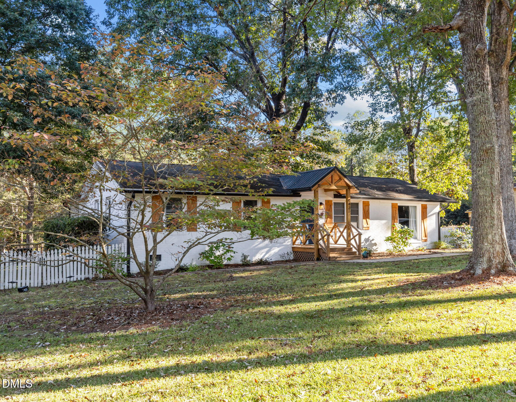 9433 Ferrell Road Zebulon, NC 27597 - Photo 32 of 38 a view of a house with a yard patio and sitting area