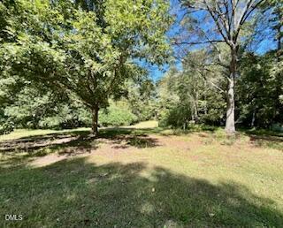 9433 Ferrell Road Zebulon, NC 27597 - Photo 33 of 38 a view of a yard with trees
