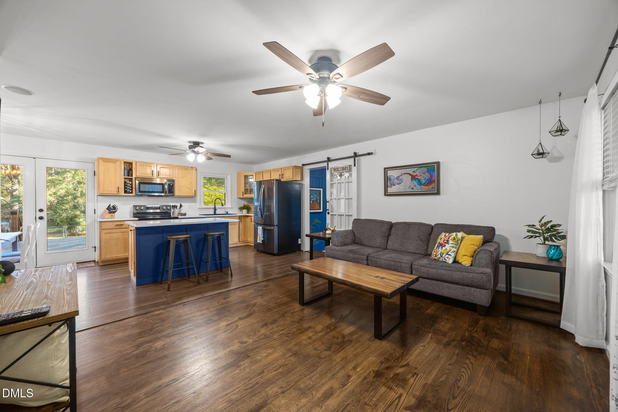 9433 Ferrell Road Zebulon, NC 27597 - Photo 4 of 38 a living room with furniture and kitchen view