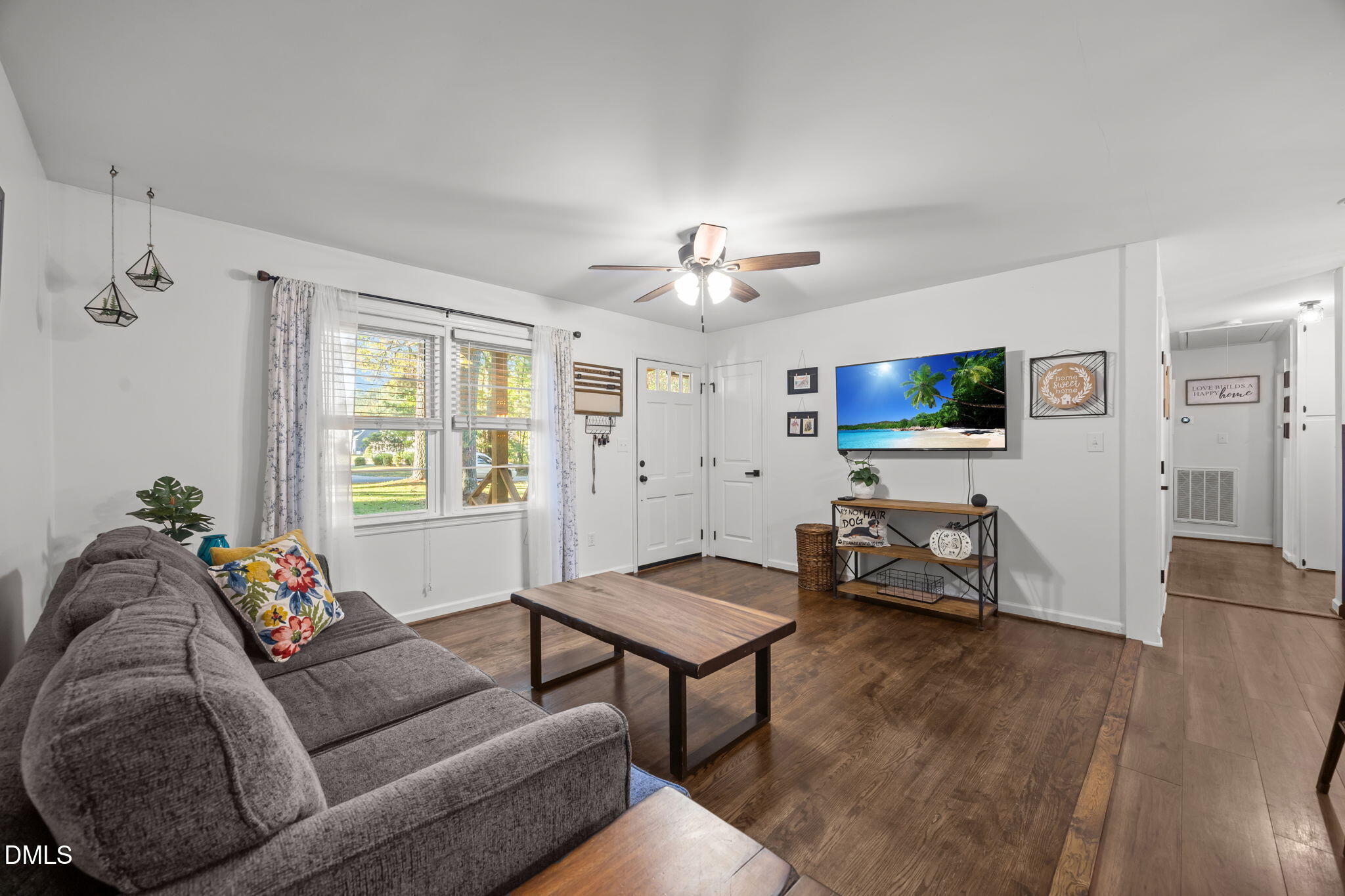 9433 Ferrell Road Zebulon, NC 27597 - Photo 5 of 38 a living room with furniture and a flat screen tv