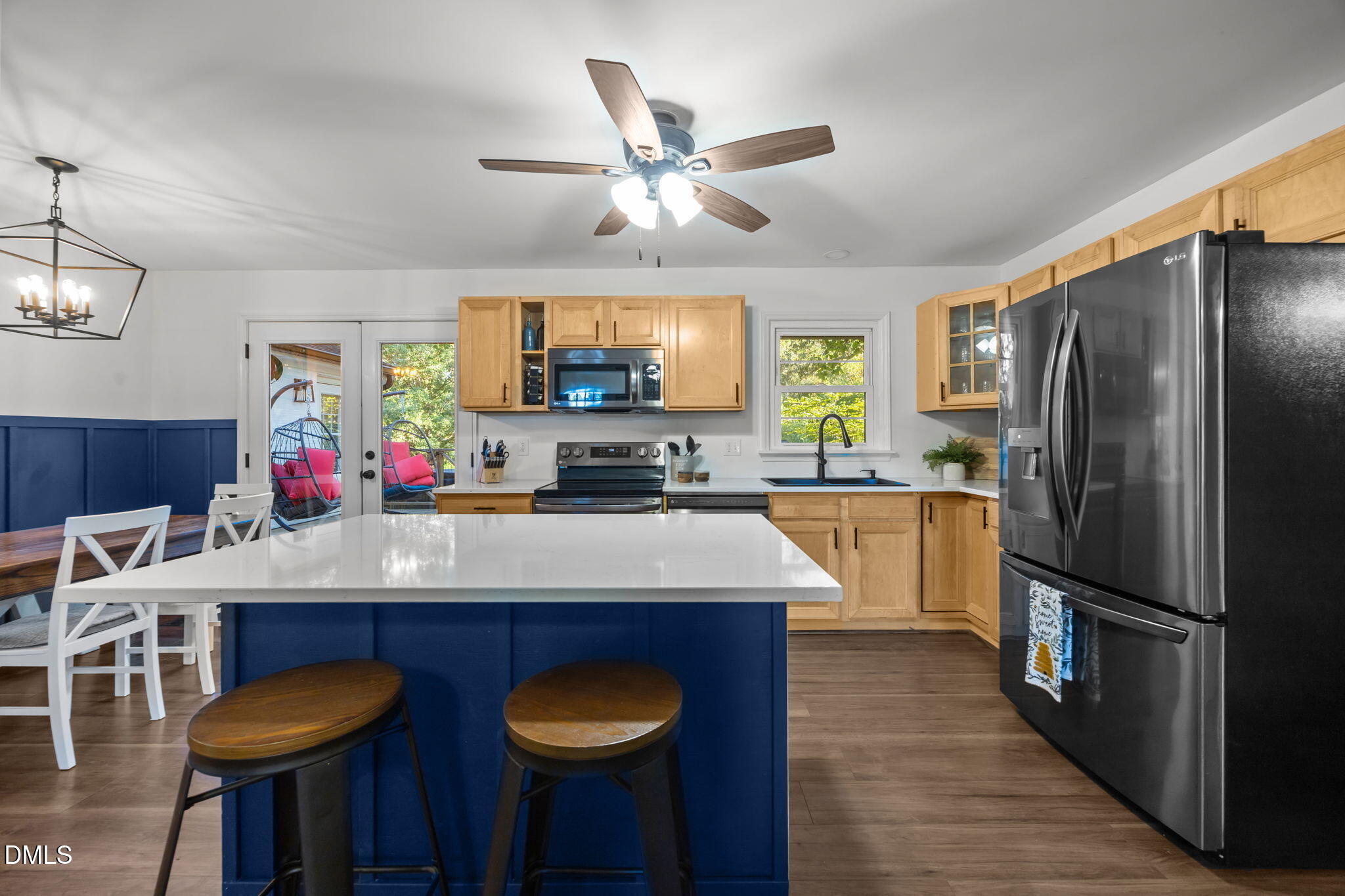 9433 Ferrell Road Zebulon, NC 27597 - Photo 7 of 38 a kitchen with stainless steel appliances granite countertop a sink refrigerator and cabinets