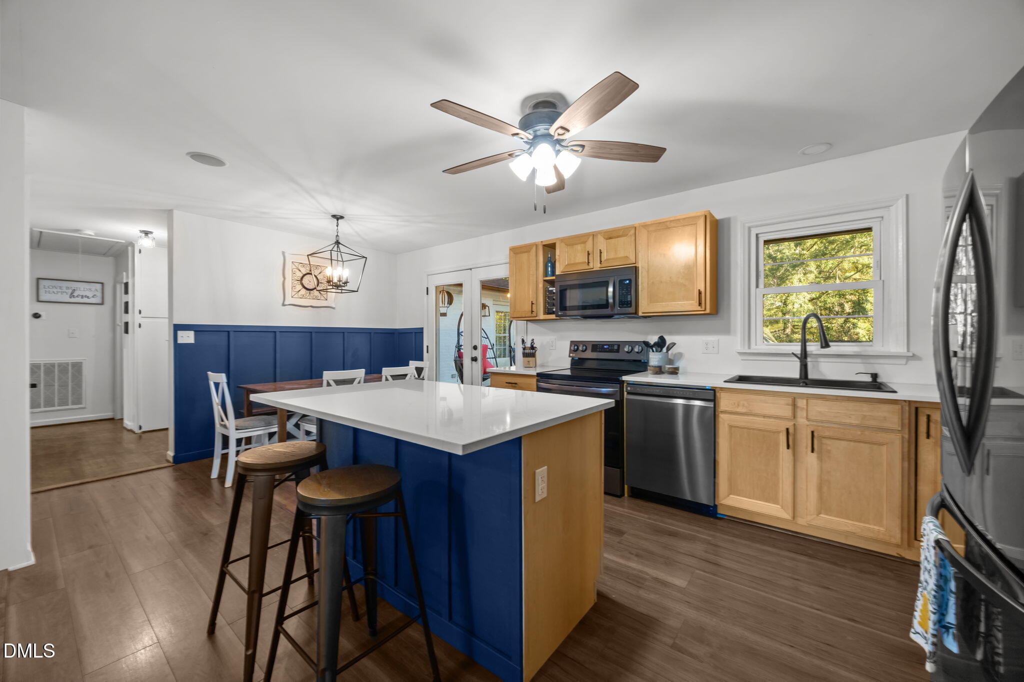 9433 Ferrell Road Zebulon, NC 27597 - Photo 10 of 38 a kitchen with a counter space a sink appliances and cabinets