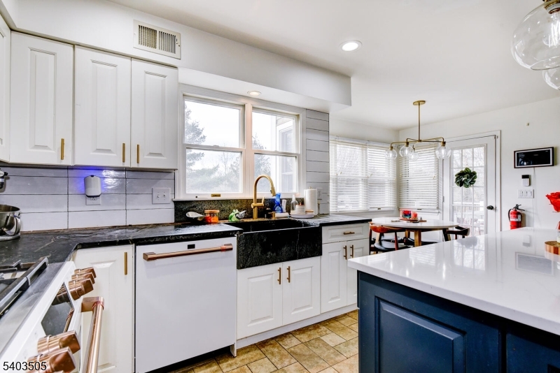 3 Fine Road Hillsborough, NJ 08844 - Photo 20 of 47 a kitchen with a sink stove and cabinets