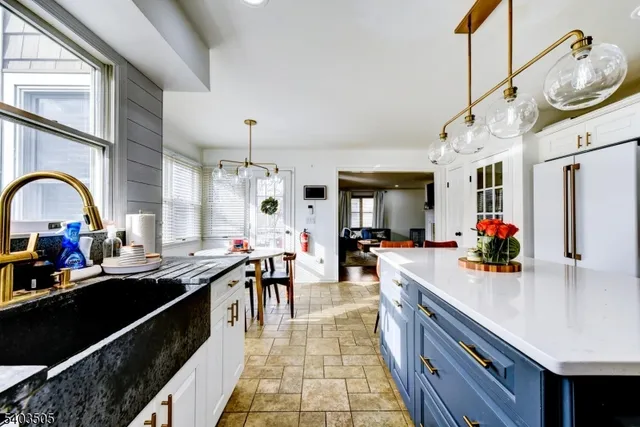 a large kitchen with stainless steel appliances lots of counter top space