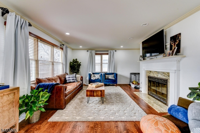 3 Fine Road Hillsborough, NJ 08844 - Photo 23 of 47 a living room with furniture fireplace and flat screen tv