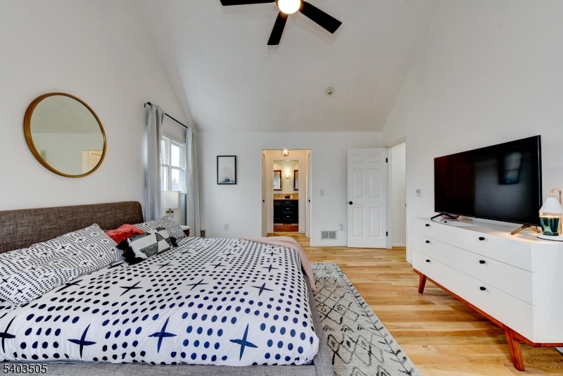 3 Fine Road Hillsborough, NJ 08844 - Photo 29 of 47 a bedroom with a bed and flat screen tv