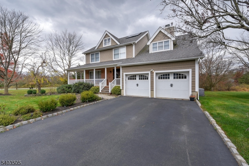 3 Fine Road Hillsborough, NJ 08844 - Photo 3 of 47 a front view of a house with a yard and garage