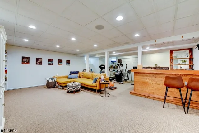 a gym room with furniture and a table