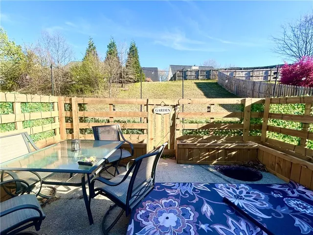 a view of an outdoor sitting area with furniture