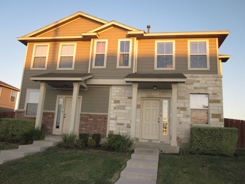 13712 Harris Ridge Boulevard, Unit B Pflugerville, TX 78660 - Photo 1 of 1 a front view of a house with a yard