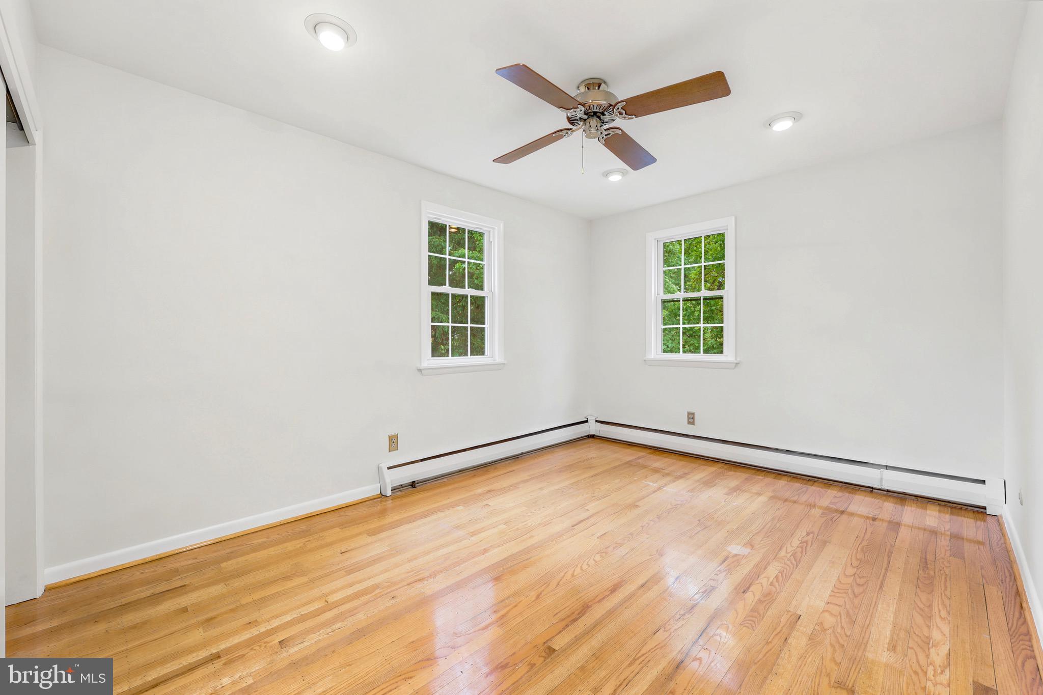 412 Yorkshire Road Bryn Mawr, PA 19010 - Photo 21 of 25 an empty room with a window and ceiling fan