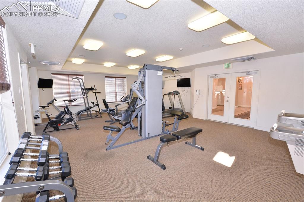 6967 Stetson Ranch Point, Unit 105 Colorado Springs, CO 80922 - Photo 26 of 37 a view of a room with gym equipment